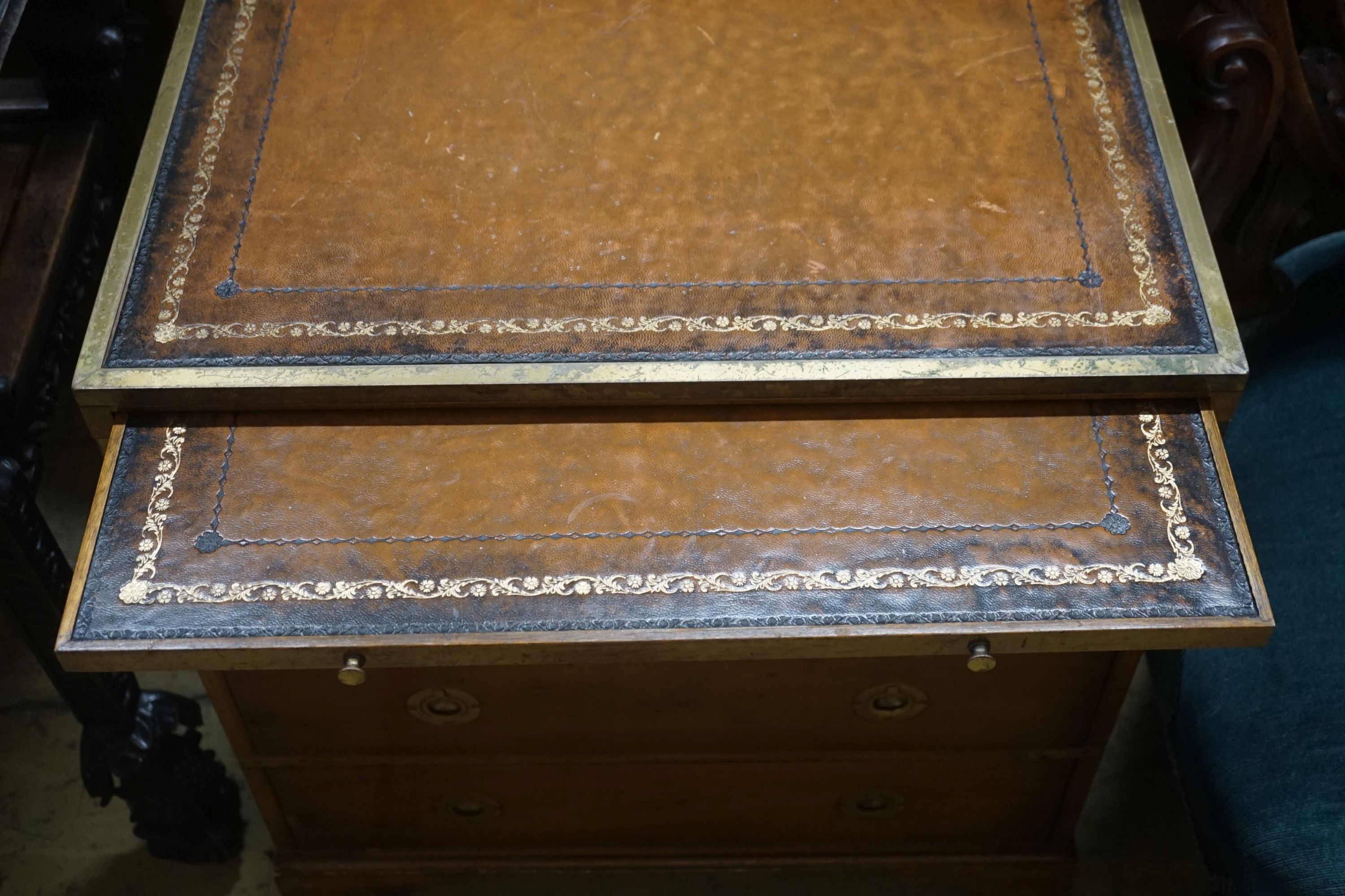 A pair of reproduction brass mounted military style yew veneered bedside chests with leather inset tops, width 56cm, depth 40cm, height 60cm